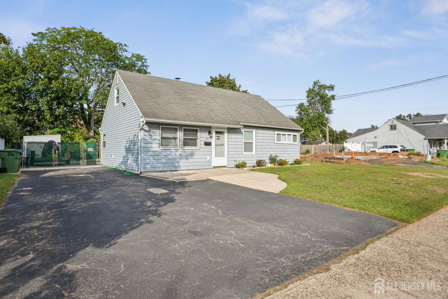 12 Brookville Road Edison, NJ 08817 - Photo 24 of 25 a view of a house with a yard and garage