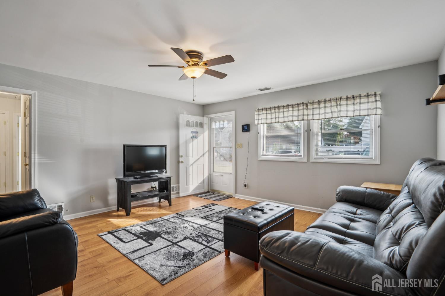 12 Brookville Road Edison, NJ 08817 - Photo 3 of 25 a living room with furniture and a flat screen tv