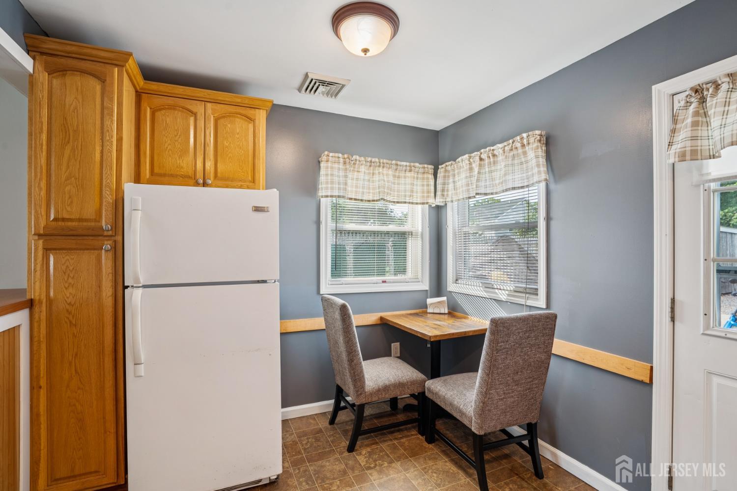 12 Brookville Road Edison, NJ 08817 - Photo 7 of 25 a view of a dining room with furniture window and outside view