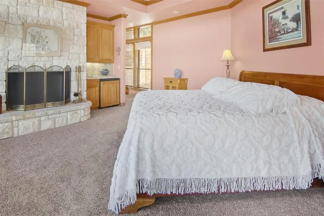 a spacious bedroom with a bed and a couch