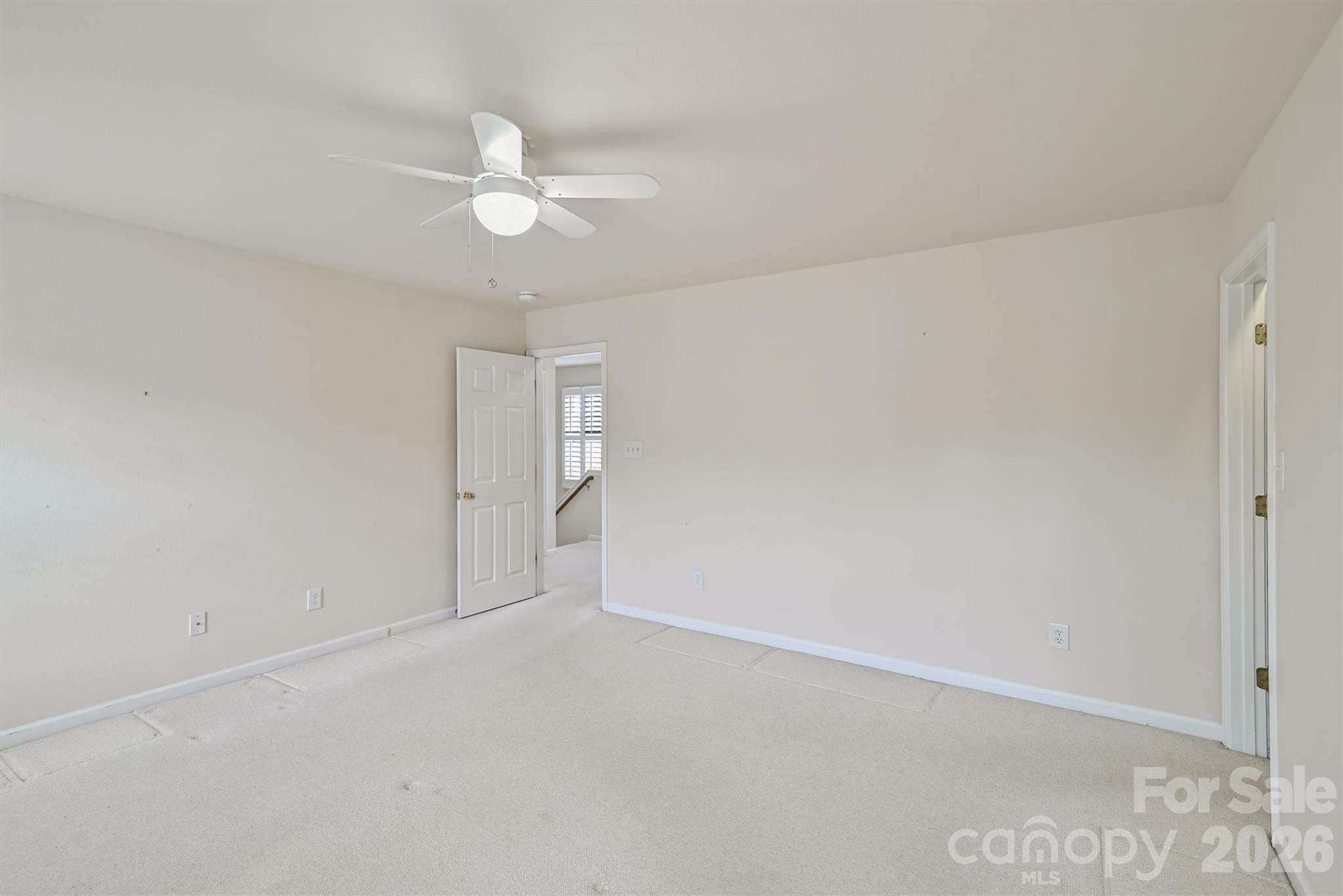 4160 Segundo Lane Fort Mill, SC 29707 - Photo 17 of 30 an empty room with a fan and a ceiling fan