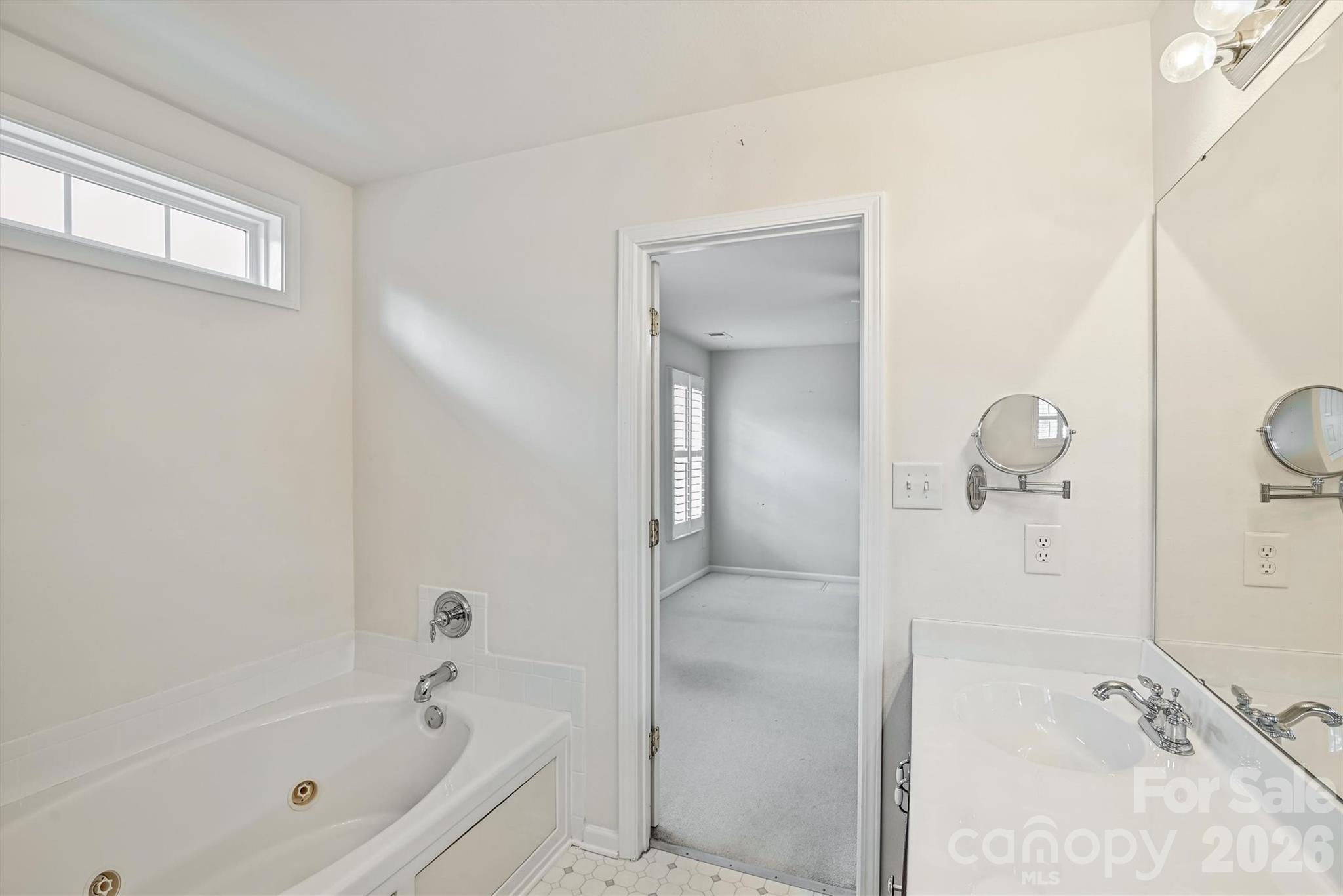 4160 Segundo Lane Fort Mill, SC 29707 - Photo 20 of 30 a bathroom with a tub a sink and mirror