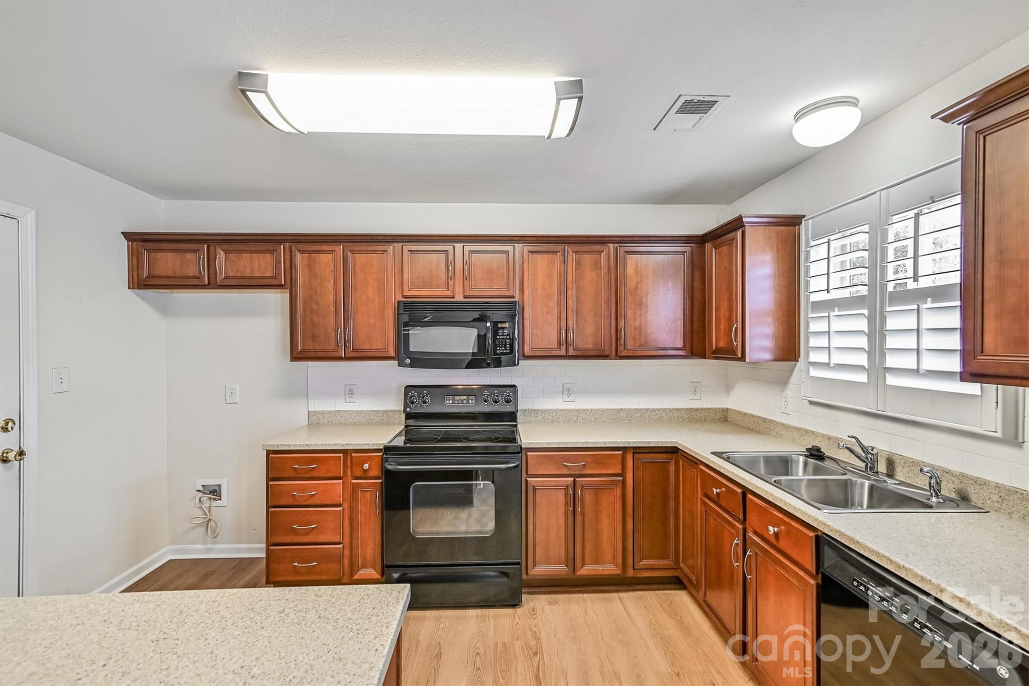 4160 Segundo Lane Fort Mill, SC 29707 - Photo 4 of 30 a kitchen with stainless steel appliances a stove sink and cabinets
