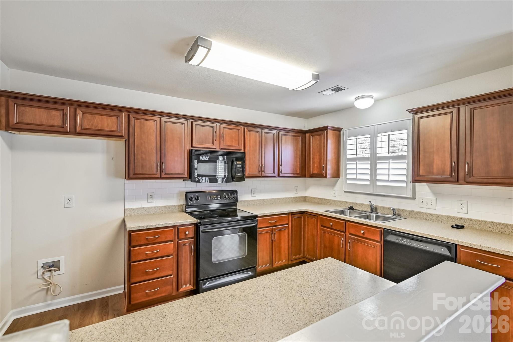 4160 Segundo Lane Fort Mill, SC 29707 - Photo 5 of 30 a kitchen with stainless steel appliances a sink stove refrigerator and cabinets