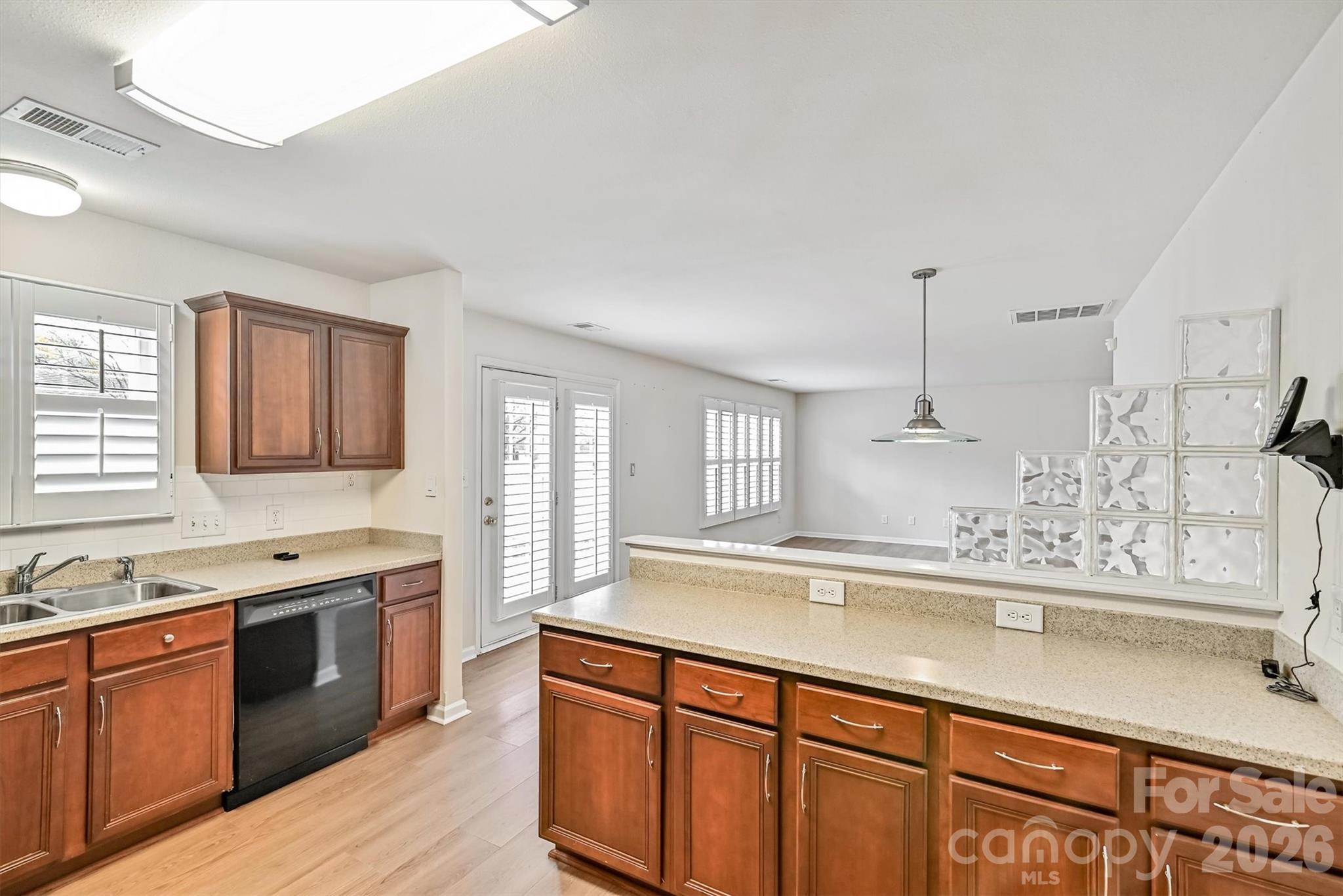 4160 Segundo Lane Fort Mill, SC 29707 - Photo 6 of 30 a kitchen with stainless steel appliances granite countertop a sink a stove and a wooden floors