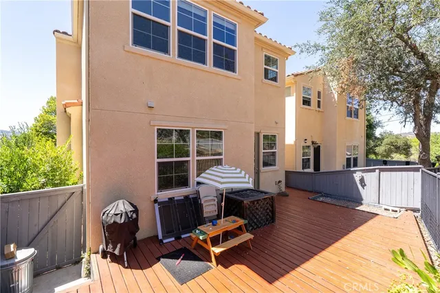 a view of deck with wooden floor and outdoor seating