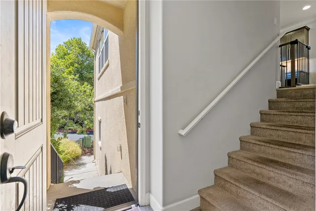 a view of staircase with wooden floor and a potted plant