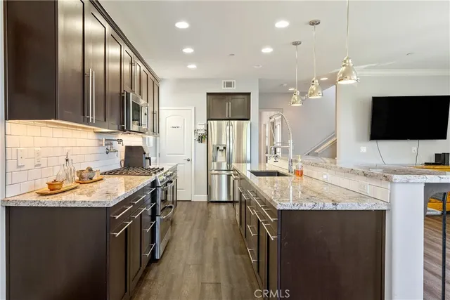 a spacious bathroom with a granite countertop sink and a mirror