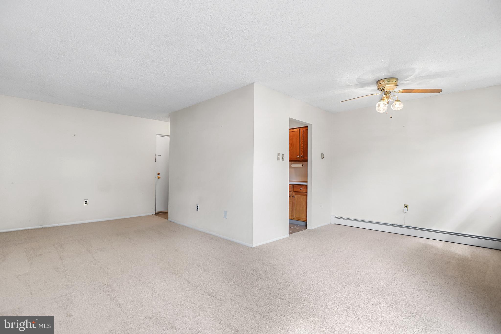 280 Bridgewater Road, Unit D4 Brookhaven, PA 19015 - Photo 4 of 15 an empty room with closet and a ceiling fan