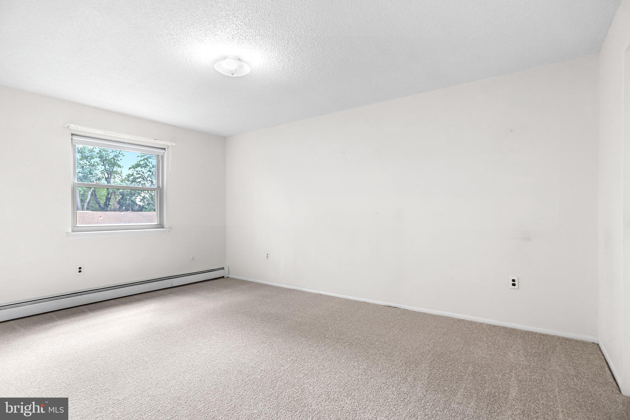 280 Bridgewater Road, Unit D4 Brookhaven, PA 19015 - Photo 8 of 15 an empty room with windows