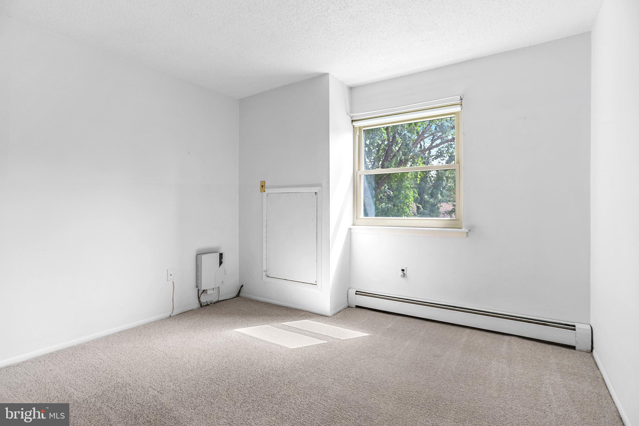 280 Bridgewater Road, Unit D4 Brookhaven, PA 19015 - Photo 10 of 15 an empty room with a window and ceiling fan