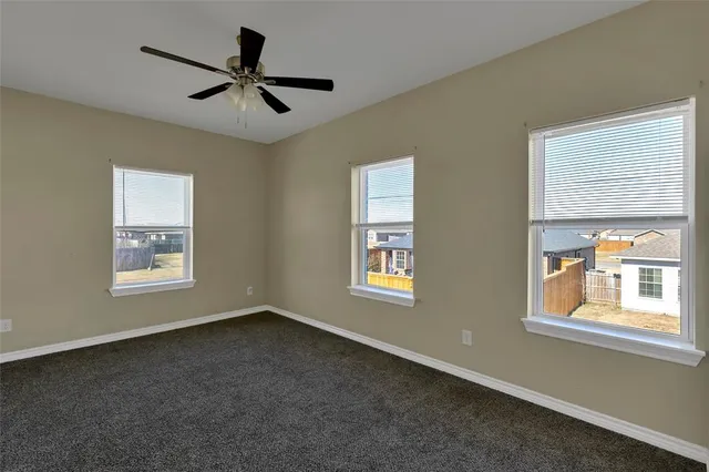a bathroom with a granite countertop sink a toilet and shower