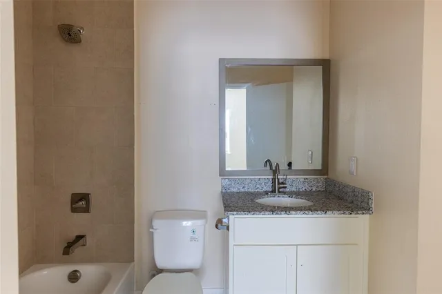 a view of a bathroom from a hallway