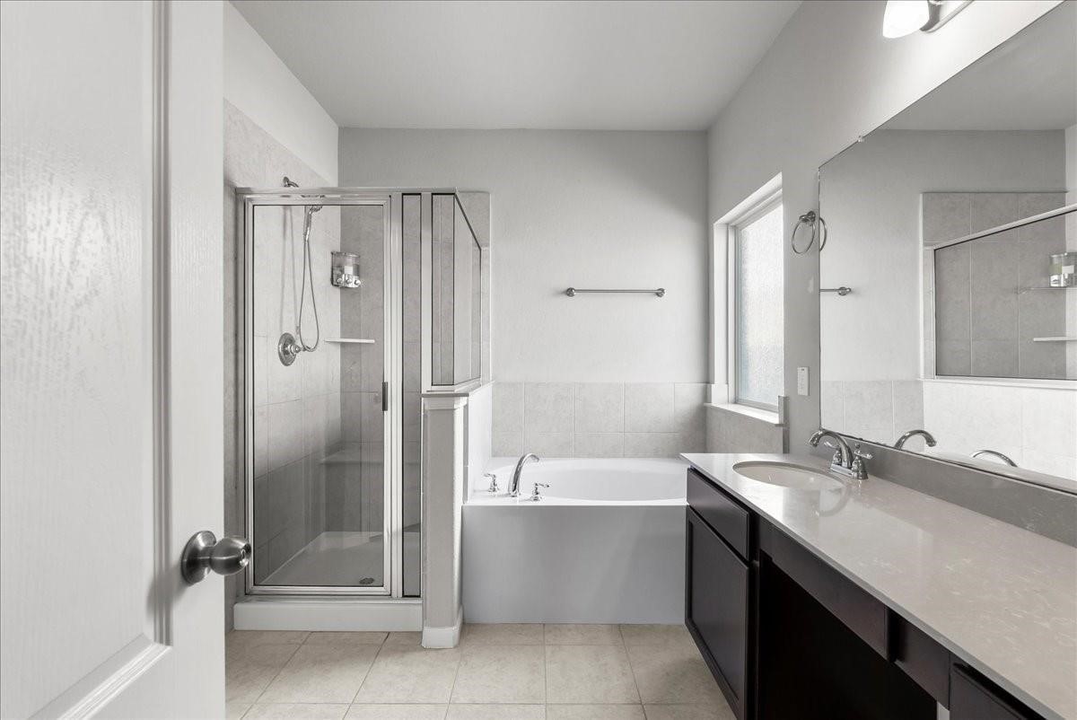 5111 Bay Lane Bacliff, TX 77518 - Photo 22 of 48 a bathroom with a tub sink shower and a mirror