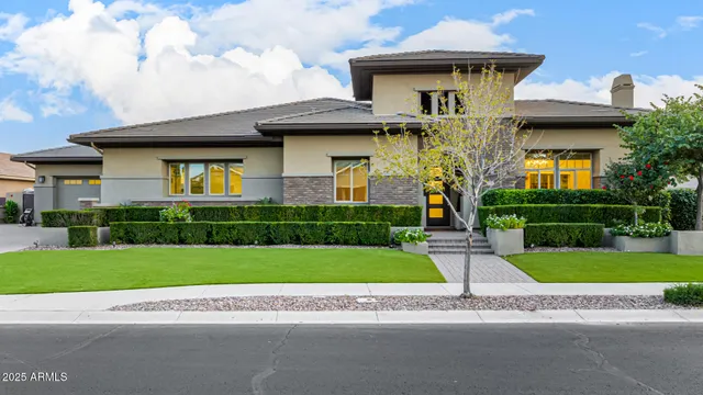 a living room with furniture a chandelier and a large window