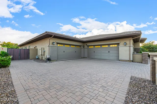 a large kitchen with kitchen island a stove a sink a dining table and chairs with the view of kitchen