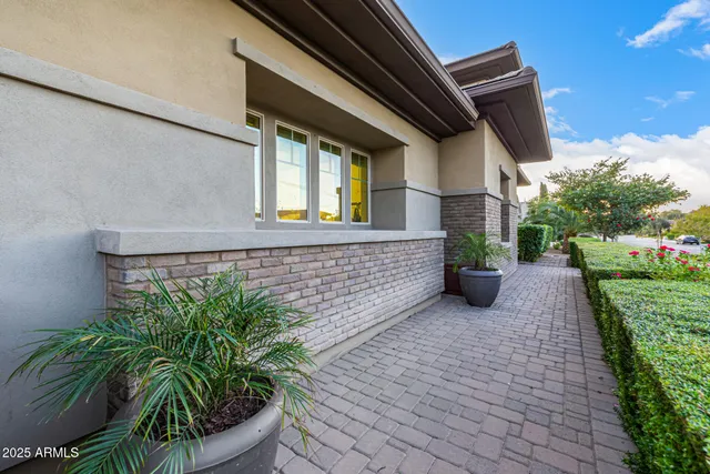 a kitchen with a table chairs refrigerator and cabinets