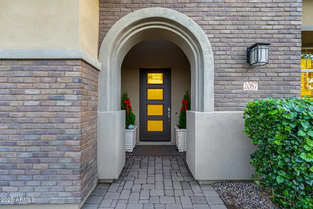 a kitchen with a sink and a stove with wooden floor