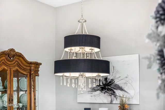 a bedroom with a bed and painting on the wall