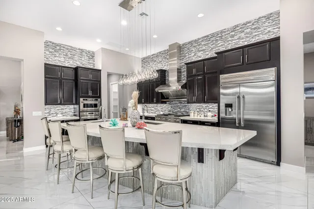 a view of a patio with dining table and chairs with wooden floor