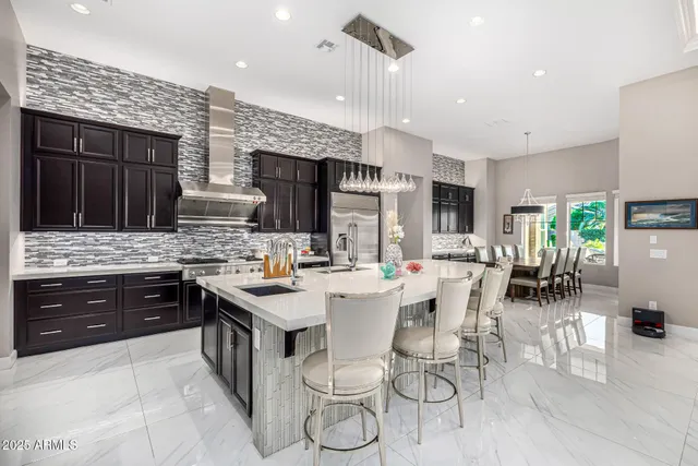 a view of a patio with a table and chairs