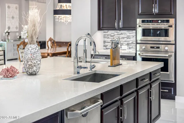 an aerial view of a house with a garden and trees