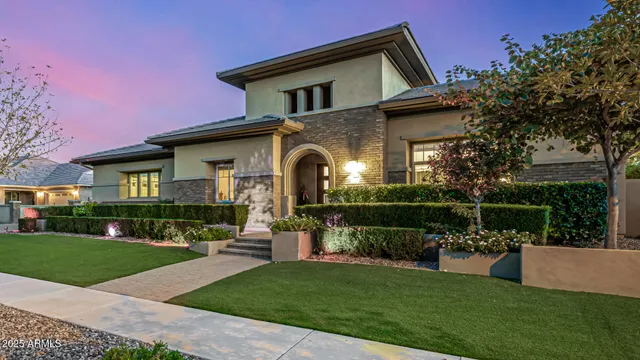 a front view of house with yard and green space