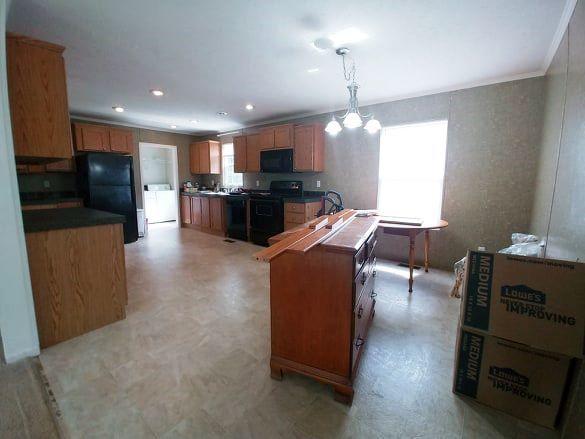 180 Factory Hill Road Callaway, VA 24067 - Photo 3 of 14 a living room with furniture a flat screen tv and kitchen view
