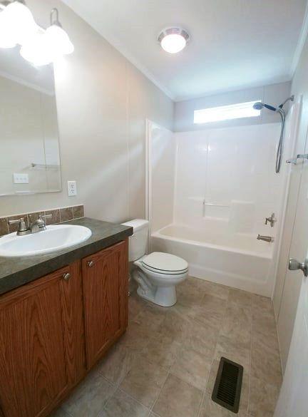 180 Factory Hill Road Callaway, VA 24067 - Photo 9 of 14 a bathroom with a sink a toilet and shower