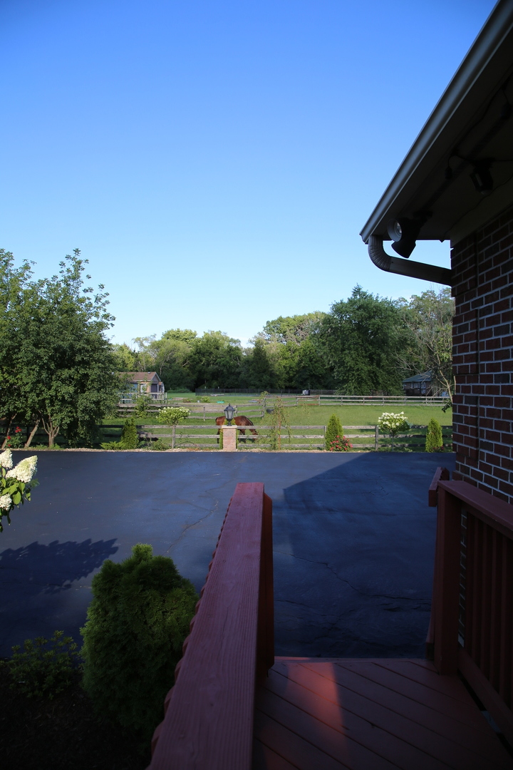28W130 Roosevelt Road Winfield, IL 60190 - Photo 11 of 54 a view of a swimming pool with an outdoor seating and a yard