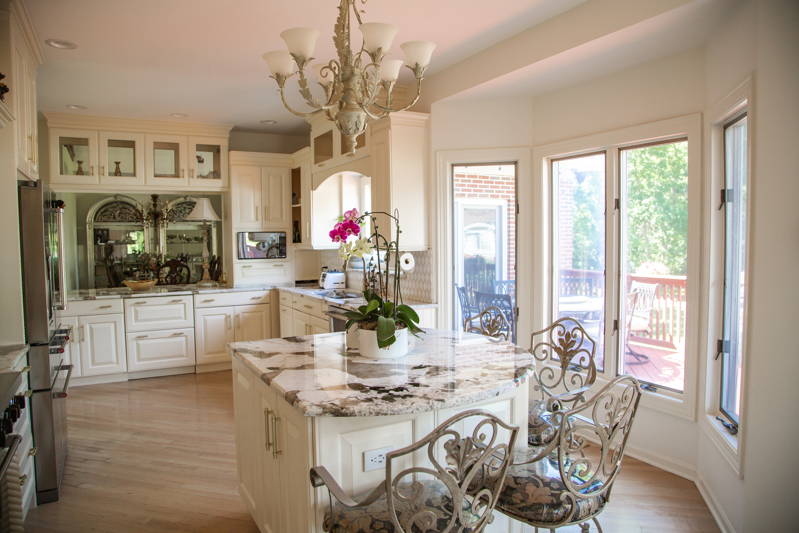 28W130 Roosevelt Road Winfield, IL 60190 - Photo 17 of 54 a view of a dining room with furniture wooden floor and chandelier