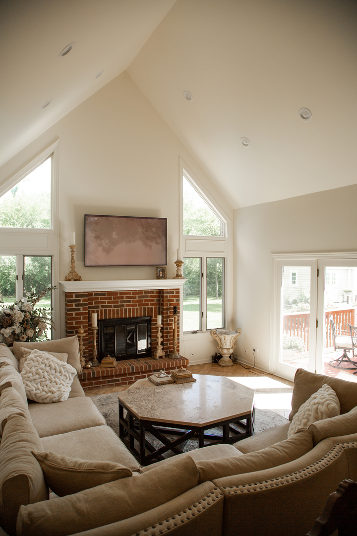 28W130 Roosevelt Road Winfield, IL 60190 - Photo 23 of 54 a living room with furniture and a fireplace