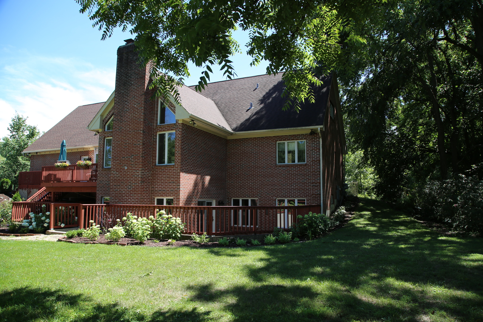 28W130 Roosevelt Road Winfield, IL 60190 - Photo 3 of 54 a view of a house with a garden
