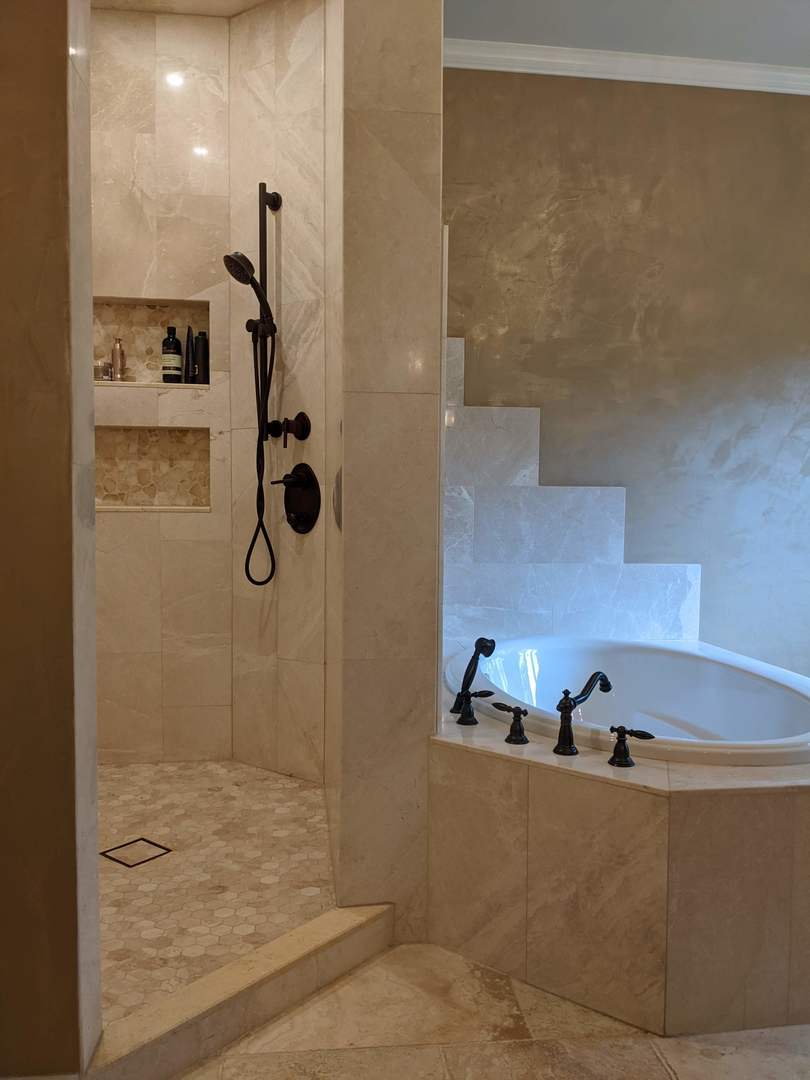 28W130 Roosevelt Road Winfield, IL 60190 - Photo 45 of 54 a bathroom with a tub and shower