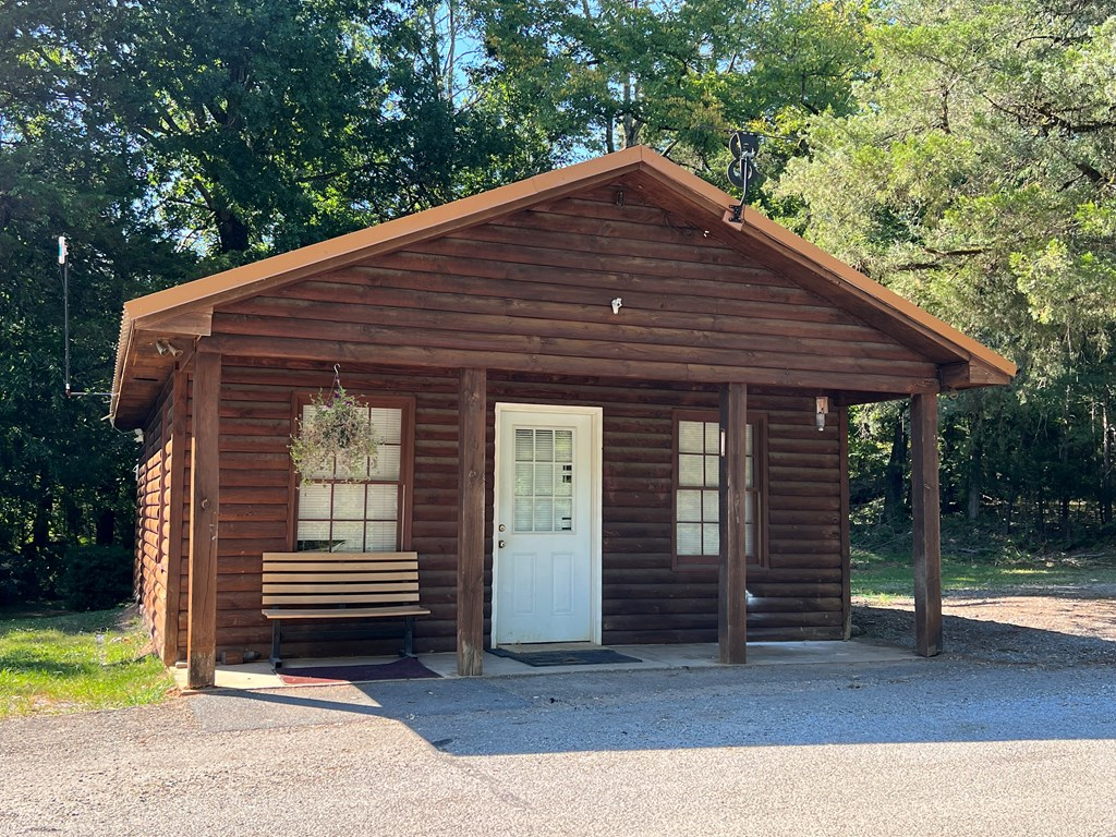 197 Stirratt Road Ranger, GA 30734 - Photo 14 of 25 a front view of a house with a garden