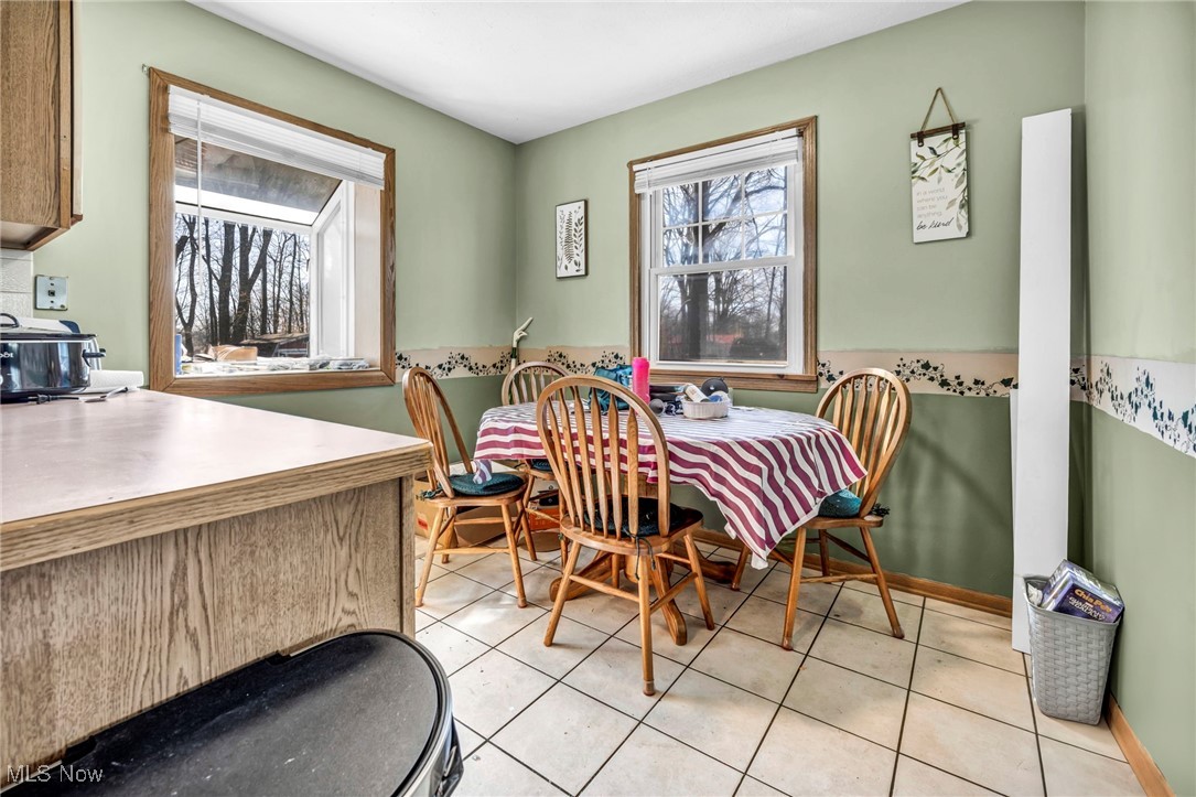 725 Neal Road, Unit 723 Akron, OH 44312 - Photo 20 of 47 Dining space featuring light tile patterned flooring