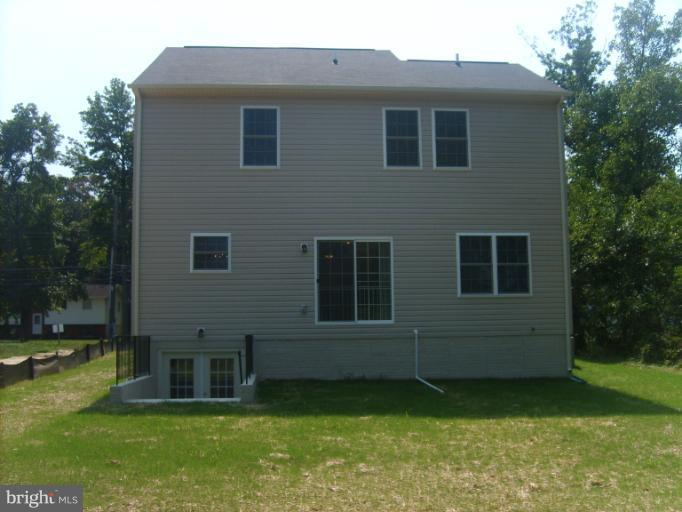 7720 North Point Road Edgemere, MD 21219 - Photo 13 of 22 a view of a house with a yard