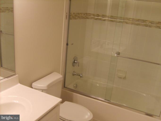 7720 North Point Road Edgemere, MD 21219 - Photo 5 of 22 a bathroom with a toilet and a shower