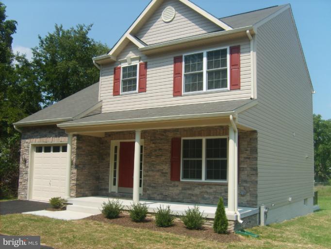 7720 North Point Road Edgemere, MD 21219 - Photo 9 of 22 a front view of a house with garden