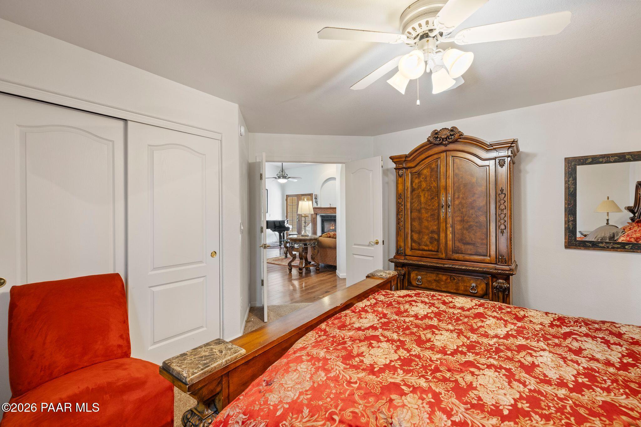 2015 Shadow Valley Ranch Road Prescott, AZ 86305 - Photo 14 of 42 a bedroom with a bed and a chandelier