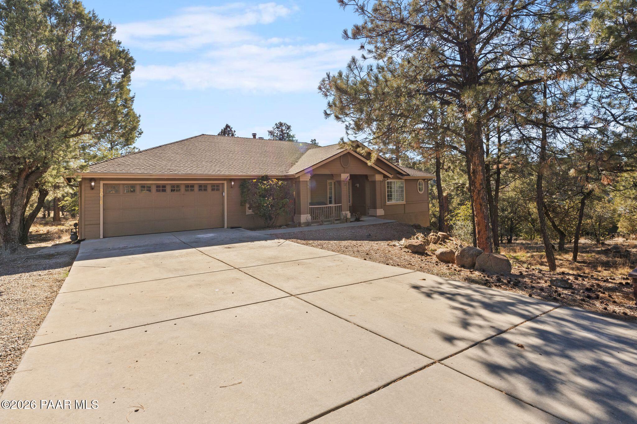 2015 Shadow Valley Ranch Road Prescott, AZ 86305 - Photo 2 of 42 a front view of a house with a garden