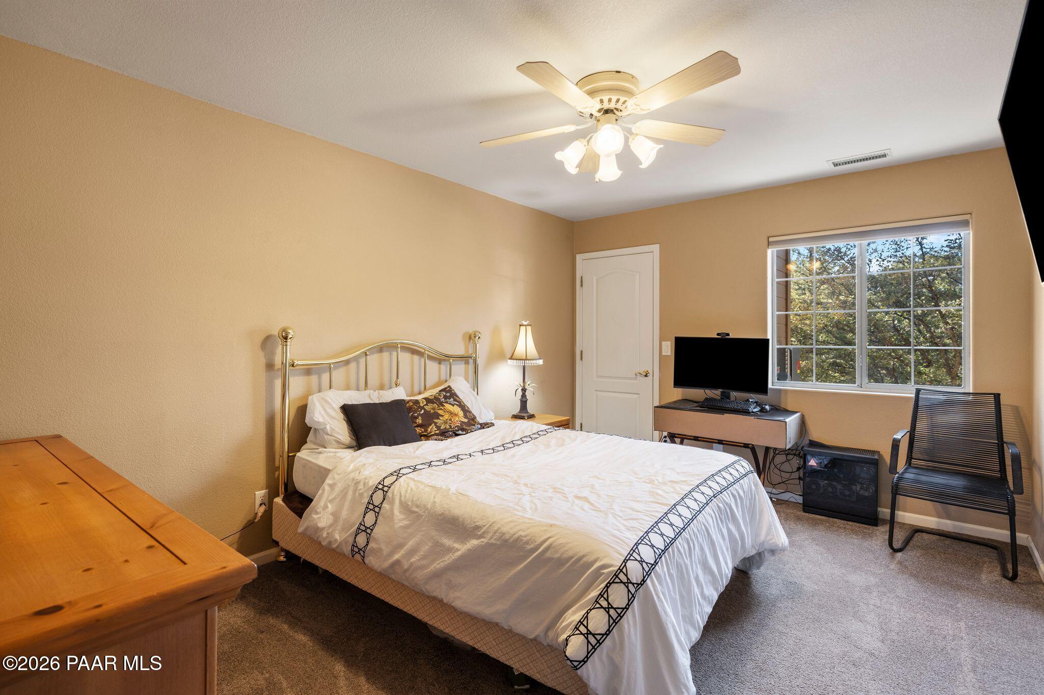 2015 Shadow Valley Ranch Road Prescott, AZ 86305 - Photo 29 of 42 a bedroom with a bed and a desk