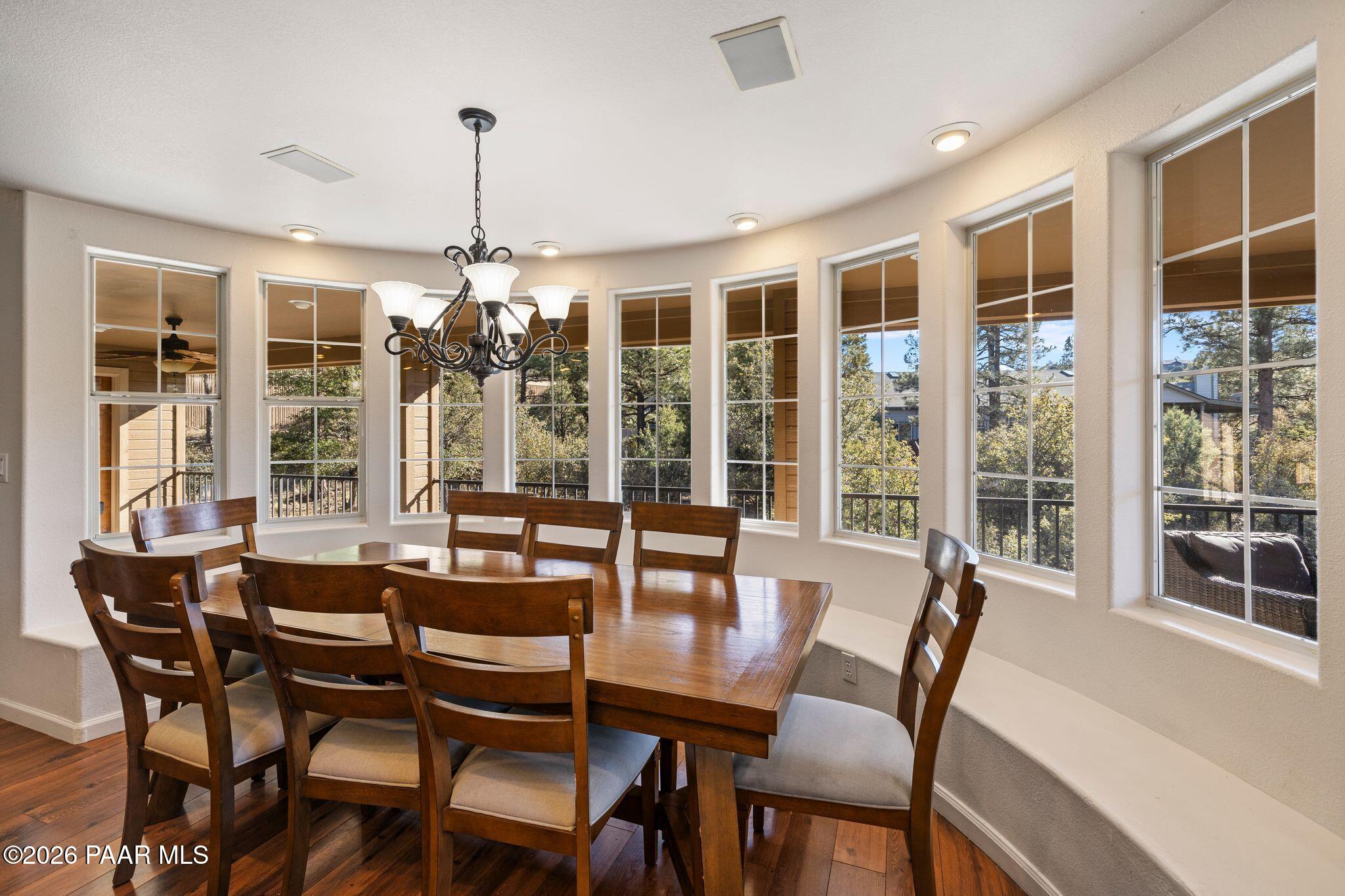 2015 Shadow Valley Ranch Road Prescott, AZ 86305 - Photo 8 of 42 a dining room with furniture large windows and a chandelier