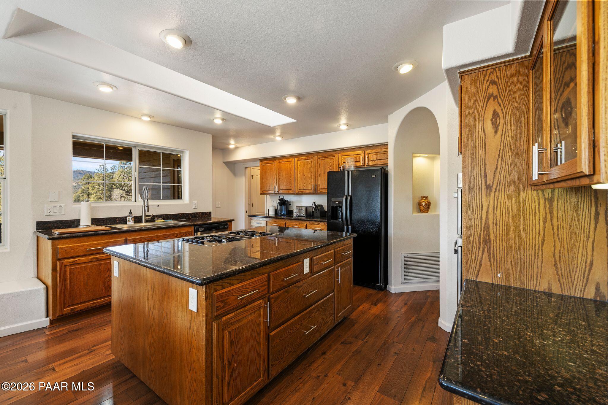 2015 Shadow Valley Ranch Road Prescott, AZ 86305 - Photo 9 of 42 a kitchen with stainless steel appliances granite countertop a stove and a refrigerator