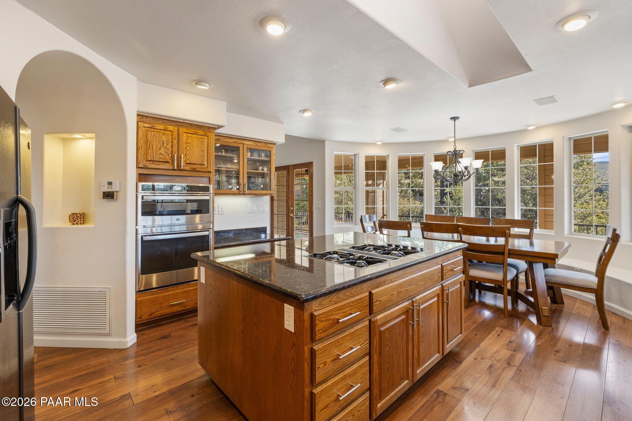 2015 Shadow Valley Ranch Road Prescott, AZ 86305 - Photo 10 of 42 a kitchen with stainless steel appliances granite countertop a stove and a refrigerator