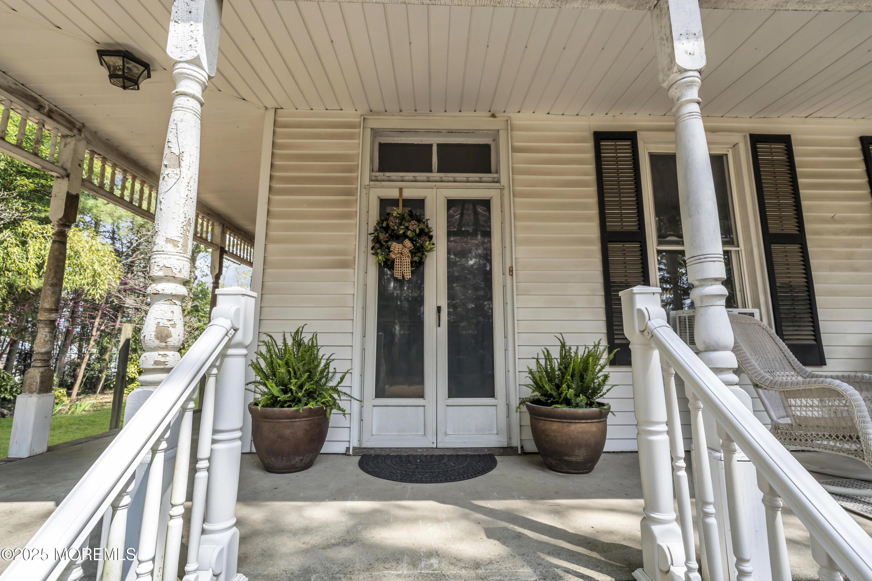 627 Beers Street Hazlet, NJ 07730 - Photo 14 of 64 a potted plant sitting on the side of a building