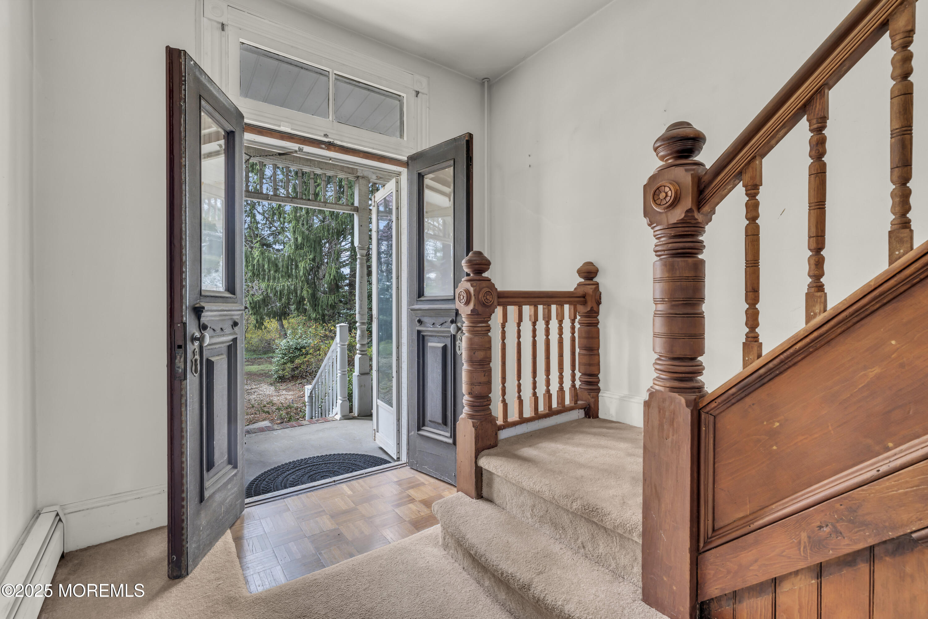 627 Beers Street Hazlet, NJ 07730 - Photo 15 of 64 a view of a porch with wooden floor and stairs