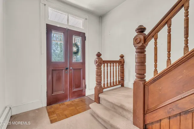 a view of livingroom with furniture fireplace and window