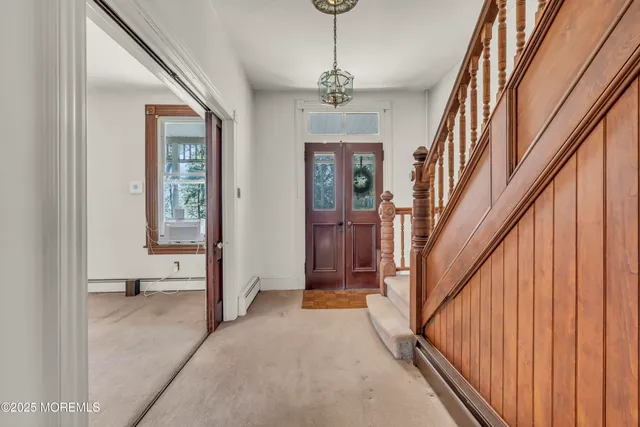 a kitchen with a refrigerator a sink and dishwasher with wooden floor