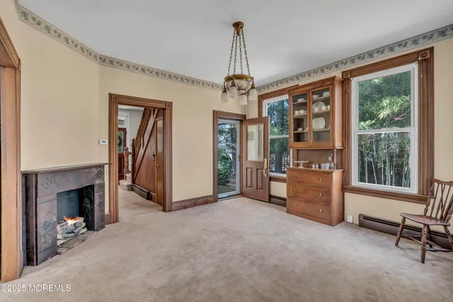 a dining room with furniture and window